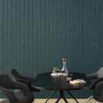 Woven image longitude acoustic panels in jade green behind table and chairs